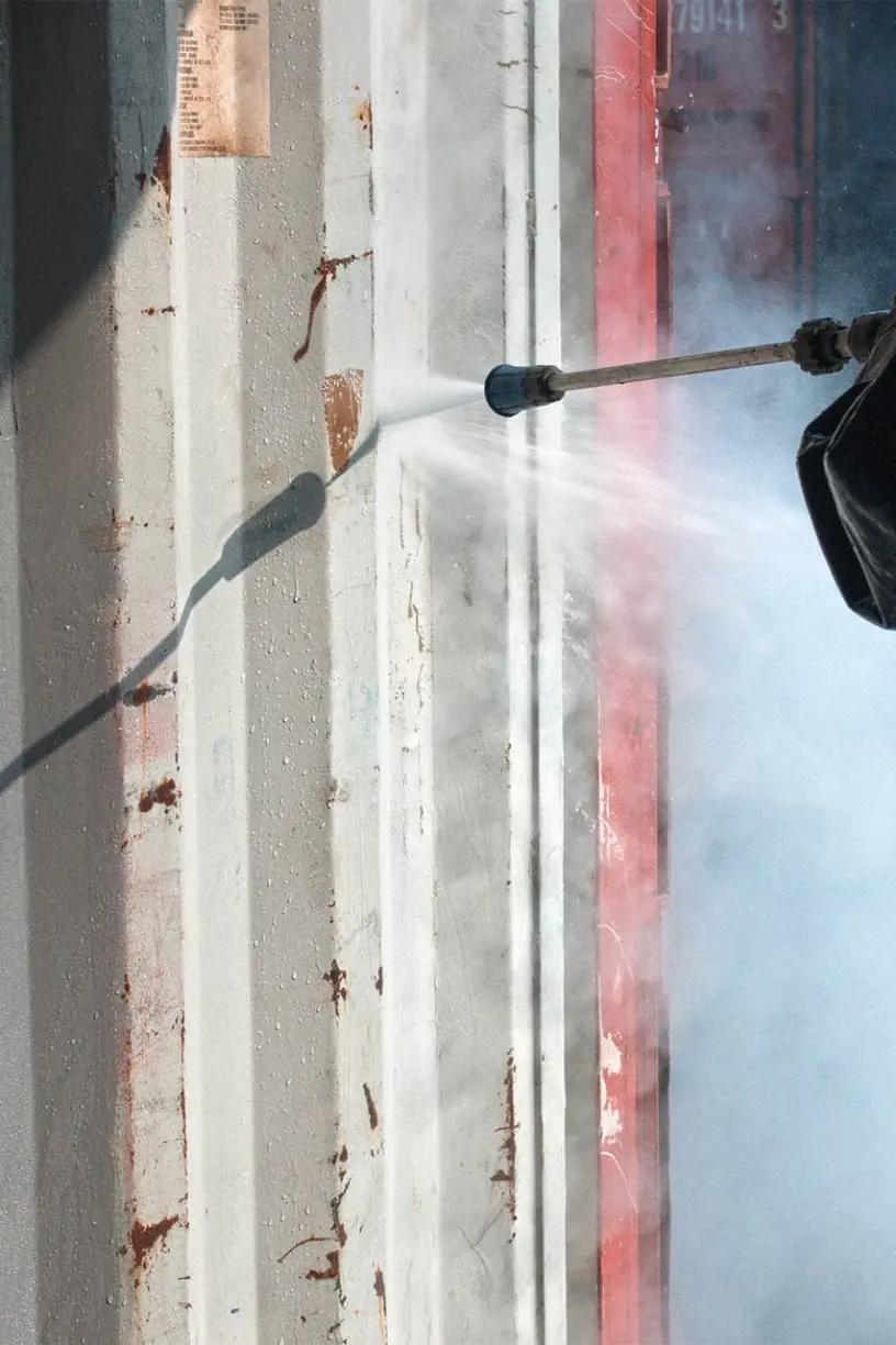 Spraying shipping container